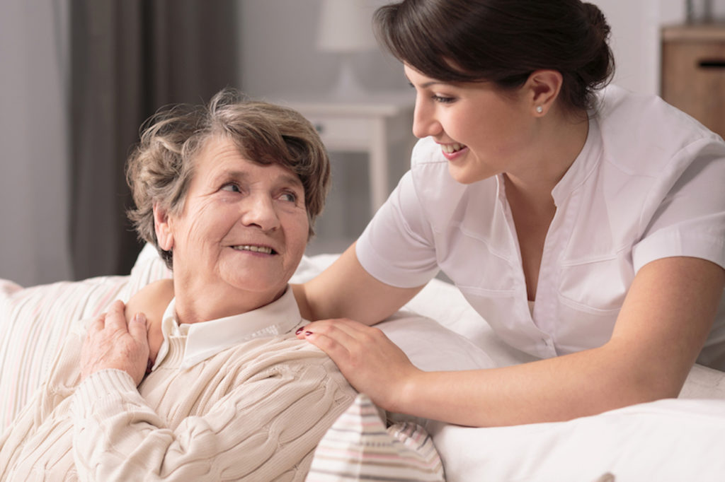Woman caring for senior resident